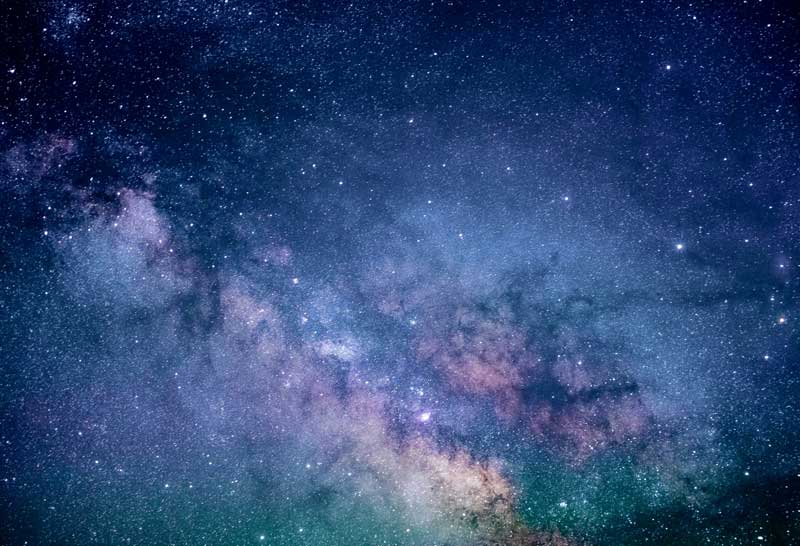 Photo of cosmic stars by Jeremy Thomas for Unsplash